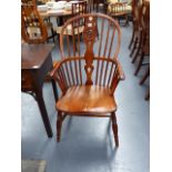 A YEW WOOD AND ELM WINDSOR ARMCHAIR.
