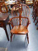 A YEW WOOD AND ELM WINDSOR ARMCHAIR.