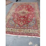 A PERSIAN HERIZ CARPET. 287x209cms.