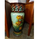 A VICTORIAN POTTERY UMBRELLA/STICK STAND. DECORATED WITH BIRDS AND FLOWERS. H.66cm.