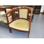 AN EDWARDIAN INLAID MAHOGANY TUB FORM ARMCHAIR.