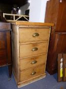 A SMALL ANTIQUE PINE CHEST OF FOUR DRAWERS ON PLINTH BASE. W.50cms.