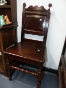 TWO EARLY CARVED OAK BACK STOOLS WITH RING TURNED FRONT LEGS AND STRETCHERS.