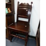 TWO EARLY CARVED OAK BACK STOOLS WITH RING TURNED FRONT LEGS AND STRETCHERS.