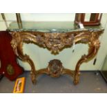 AN ANTIQUE FRENCH CARVED GILTWOOD LOUIS XV STYLE CONSOLE TABLE WITH MOULDED EDGE, SERPENTINE FORM