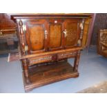 AN 18th.C.AND LATER OAK FOOD CUPBOARD WITH PIERCED PANEL DOORS OVER POTBOARD PANEL BASE. W.129cms.