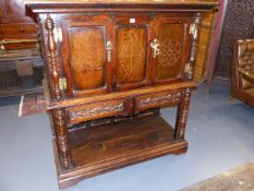 AN 18th.C.AND LATER OAK FOOD CUPBOARD WITH PIERCED PANEL DOORS OVER POTBOARD PANEL BASE. W.129cms.