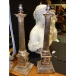 A PAIR OF ANTIQUE SILVER PLATE CORINTHIAN COLUMN FORM TABLE LAMP BASES WITH STEPPED PLINTHS