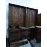 A 19th.C.OAK LARGE BOOKCASE WITH ADJUSTABLE OPEN SHELVES OVER A FOUR DOOR BASE. W.212 x H.215cms.