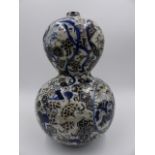 A JAPANESE GOURD FORM VASE WITH UNUSUAL FOLIATE AND GEOMETRIC DECORATION. H.26cms.