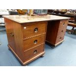 AN ANTIQUE PADOUK WOOD EXPORT TWIN PEDESTAL DESK WITH MOULDED EDGE RECTANGULAR TOP ABOVE TWO BANKS