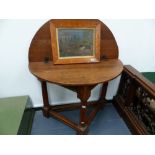 AN 18th.C.AND LATER OAK FOLD OVER CREDENCE TABLE ON GUN BARREL TURNED SUPPORTS. D.112cms.