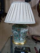 A PAIR OF CHINESE FAMILLE VERTE BALUSTER FORM VASES NOW MOUNTED AS LAMPS WITH PANELS OF VASES