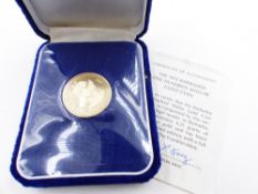 A 1975 BARBADOS ONE HUNDRED DOLLAR MINTED LIMITED EDITION FINE GOLD FULL PROOF FINISH COIN WITH
