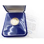 A 1975 BARBADOS ONE HUNDRED DOLLAR MINTED LIMITED EDITION FINE GOLD FULL PROOF FINISH COIN WITH