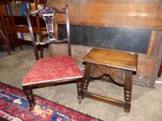 AN OAK JOINT STOOL WITH SHAPED CARVED FRIEZE TOGETHER WITH AN EDWARDIAN NURSING CHAIR. (2)`