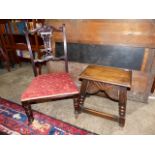 AN OAK JOINT STOOL WITH SHAPED CARVED FRIEZE TOGETHER WITH AN EDWARDIAN NURSING CHAIR. (2)`