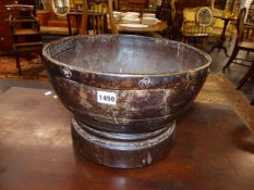 AN UNUSUAL EARLY TURNED BOWL WITH APPLIED BRASS LIP RING. D.37cms.