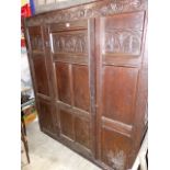 AN 18th.C.OAK PANELLED HALL OR LIVERY CUPBOARD WITH SINGLE DOOR. W.142cms.