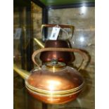 A W.A.S.BENSON COPPER AND BRASS KETTLE WITH RAFFIA HANDLE AND ANOTHER BY BENHAM & FROUD, DESIGNED BY