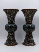 A PAIR OF CLOISONNE TRUMPET FORM VASES WITH BULBOUS WAISTS, WRITHING DRAGONS AND LOTUS DECORATION