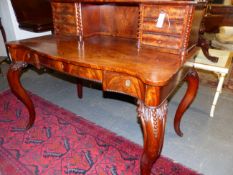 A CARVED MAHOGANY VICTORIAN SERPENTINE FORM WRITING/SIDE TABLE, SHELVED AND MULTI DRAWER