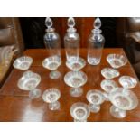 THREE CRYSTAL DECANTERS WITH CUT GLASS STOPPERS AND TWO SETS OF SIX WINE GLASSES. (15)