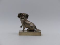 A CHINESE EXPORT WHITE METAL FIGURE OF A SEATED DOG, ENGRAVED POOR PAT PEITAIHO, 1923. APPROXIMATE