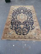 A PERSIAN SAROUK RUG. 220x138cms.