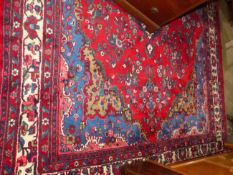 A PERSIAN HAMMADAN CARPET. 360 c 270cms.