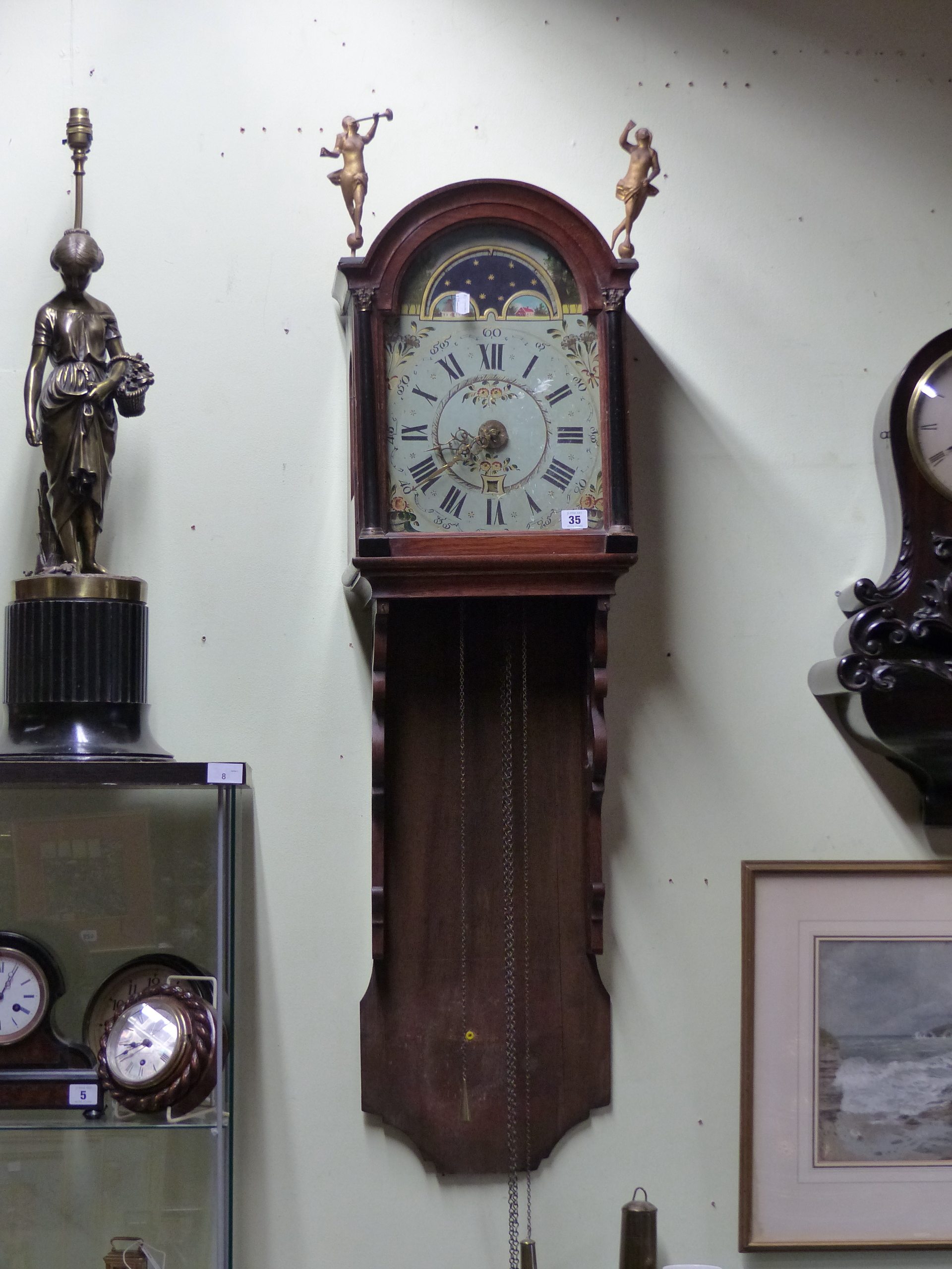 A DUTCH STAART WALL CLOCK WITH PAINTED ARCH DIAL AND HOOD SURMOUNTED WITH GILT FIGURES. COMPLETE