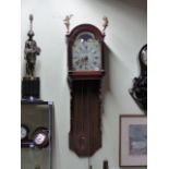 A DUTCH STAART WALL CLOCK WITH PAINTED ARCH DIAL AND HOOD SURMOUNTED WITH GILT FIGURES. COMPLETE
