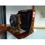 A VINTAGE QUARTER PLATE MAHOGANY CAMERA THE YNSTANTOGRAPH PATENT WITH CHRONOS LENS.