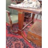 A REGENCY AND LATER MAHOGANY RISING TOP DRAWING TABLE WITH TRESTLE SUPPORTS, SABRE LEGS ENDING IN