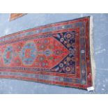 AN ANTIQUE PERSIAN HAMADAN RUNNER. 477x107cms.