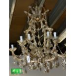 A FRENCH STYLE CAGE FORM TWELVE LIGHT CRYSTAL SCROLL ARM CHANDELIER. H.90cms.