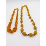 TWO ROWS OF AMBER BEADS, ONE BEING A GRADUATED IRREGULAR SHAPE,APPROXIMATE LENGTH 62cms ,APPROXIMATE