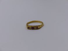 AN 18ct YELLOW GOLD RUBY AND DIAMOND CARVED HALF HOOP FIVE STONE RING. FINGER SIZE S. APPROX
