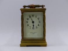 A SMALL EDWARDIAN CARRIAGE CLOCK WITH TIMEPIECE MOVEMENT AND CREAM ENAMEL DIAL SIGNED MAPPIN &