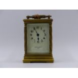 A SMALL EDWARDIAN CARRIAGE CLOCK WITH TIMEPIECE MOVEMENT AND CREAM ENAMEL DIAL SIGNED MAPPIN &