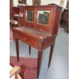 A NORTHERN EUROPEAN BRASS INLAID MAHOGANY LADIES WRITING DESK IN THE NEOCLASSIC STYLE, MIRRORED
