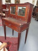 A NORTHERN EUROPEAN BRASS INLAID MAHOGANY LADIES WRITING DESK IN THE NEOCLASSIC STYLE, MIRRORED