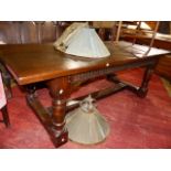 A BESPOKE 18th.C.STYLE OAK REFECTORY TABLE WITH CARVED FRIEZE , TURNED LEGS AND H-STRETCHER. 214 x