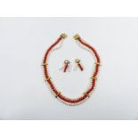 A PEARL AND CORAL TRIPLE ROW COLLAR WITH EGYPTIAN HALLMARKS TOGETHER WITH MATCHING DROP EARRINGS.