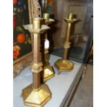 THREE BRASS ARTS AND CRAFTS PUGINESQUE ALTAR CANDLESTICKS. H.42cms.