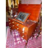 A WELL APPOINTED GENTLEMAN'S REGENCY DRESSING TABLE WITH LIFT TOP ENCLOSING A FITTED INTERIOR