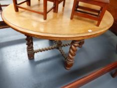 A LARGE VICTORIAN OVAL MAHOGANY CENTRE TABLE ON CARVED BARLEY TWIST SUPPORTS. APPROX.105 x 137cms.