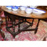 AN 18th.C.OAK COTTAGE GATELEG TABLE. W.107 x L.136cms (EXTENDED)