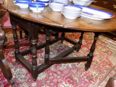 AN 18th.C.OAK COTTAGE GATELEG TABLE. W.107 x L.136cms (EXTENDED)