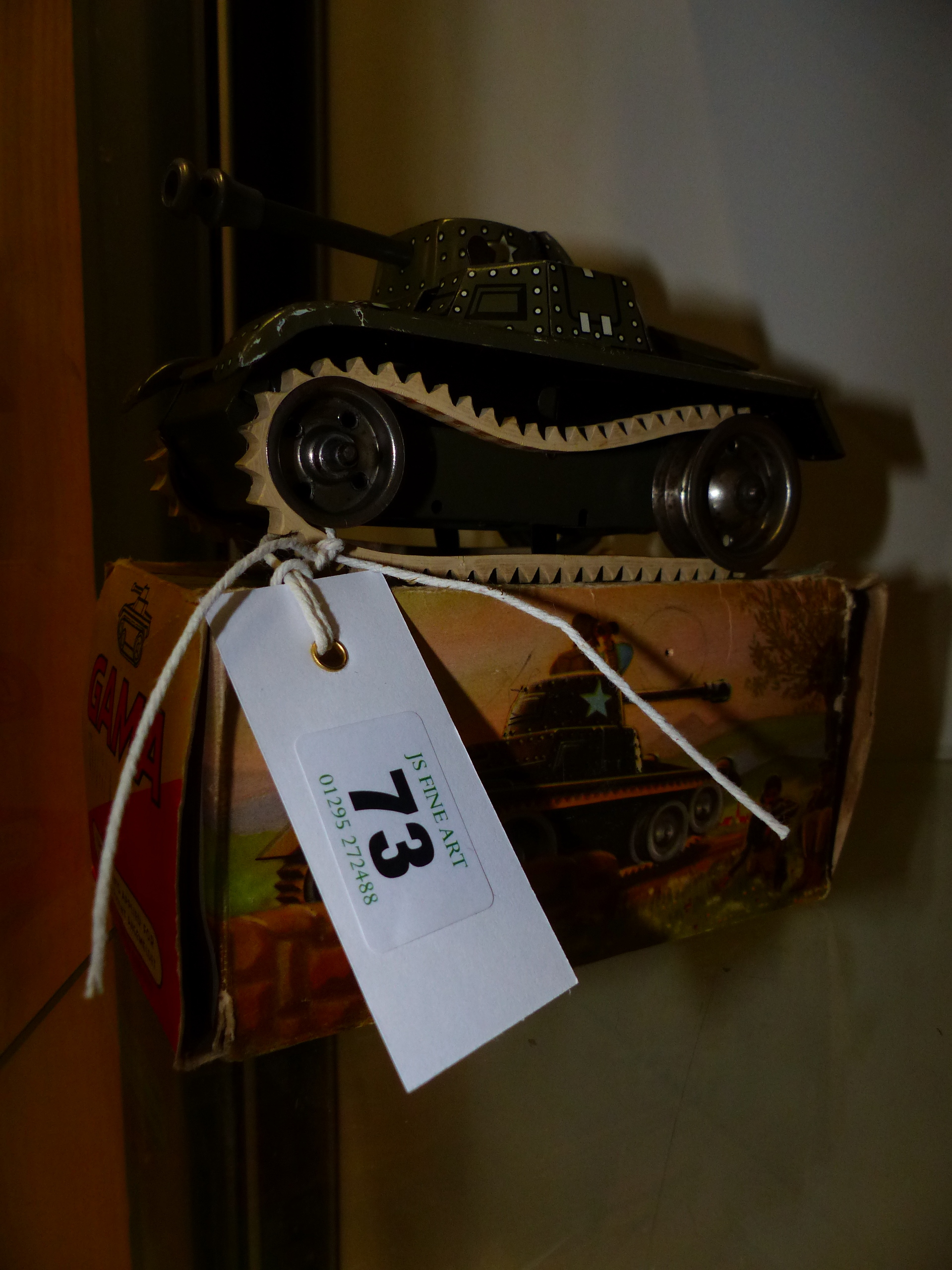 A GAMA TINPLATE CLOCKWORK TOY TANK WITH RUBBER TRACKS COMPLETE WITH BOX.